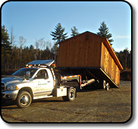 Using the specialized trailer to load a barn